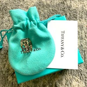 Tiffany ring, size 6.5. Authentic. Comes with pouch. Great condition.